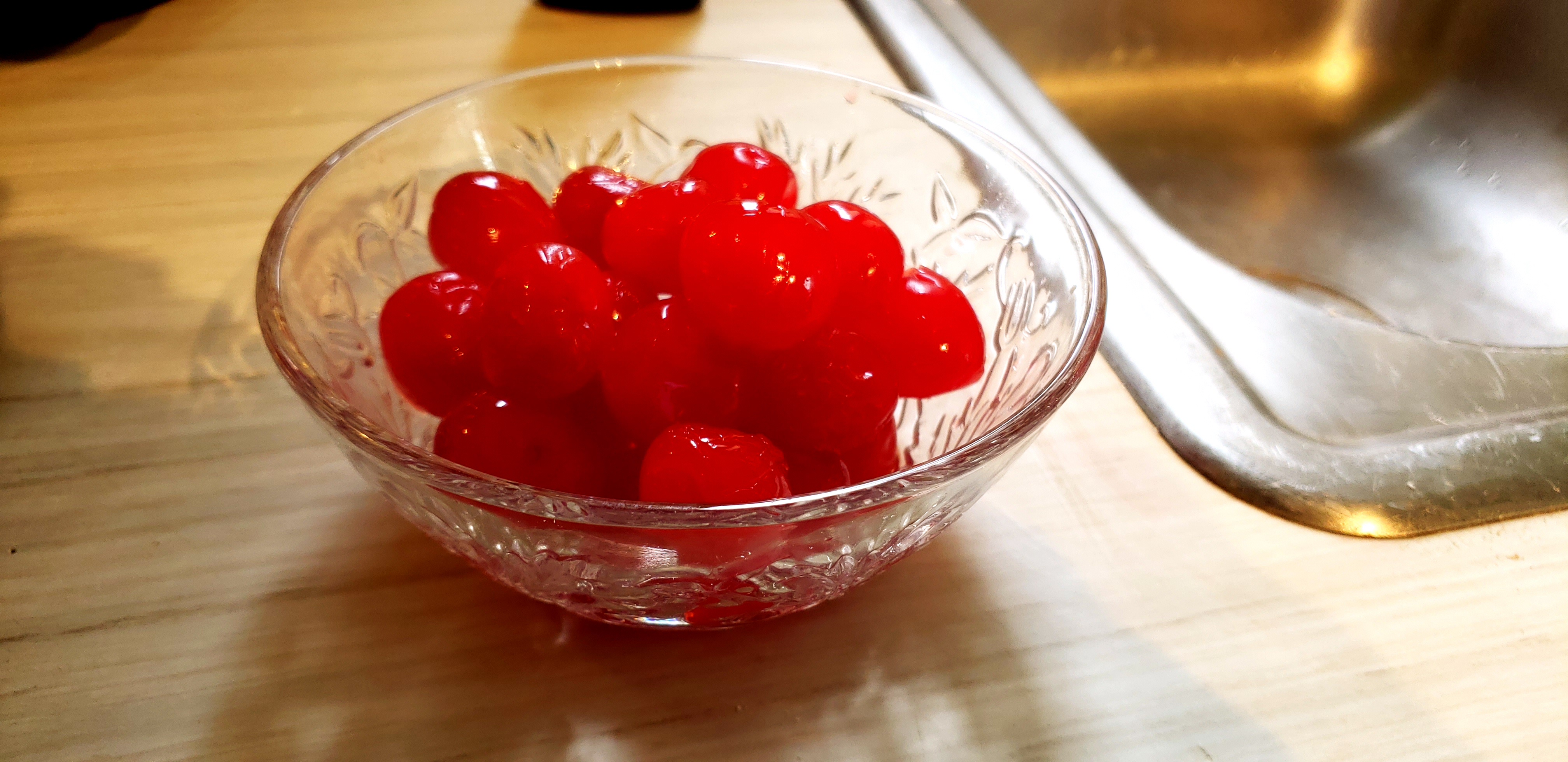 a bowl of maraschino cherries