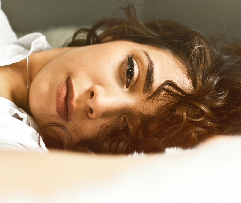 woman lying in bed