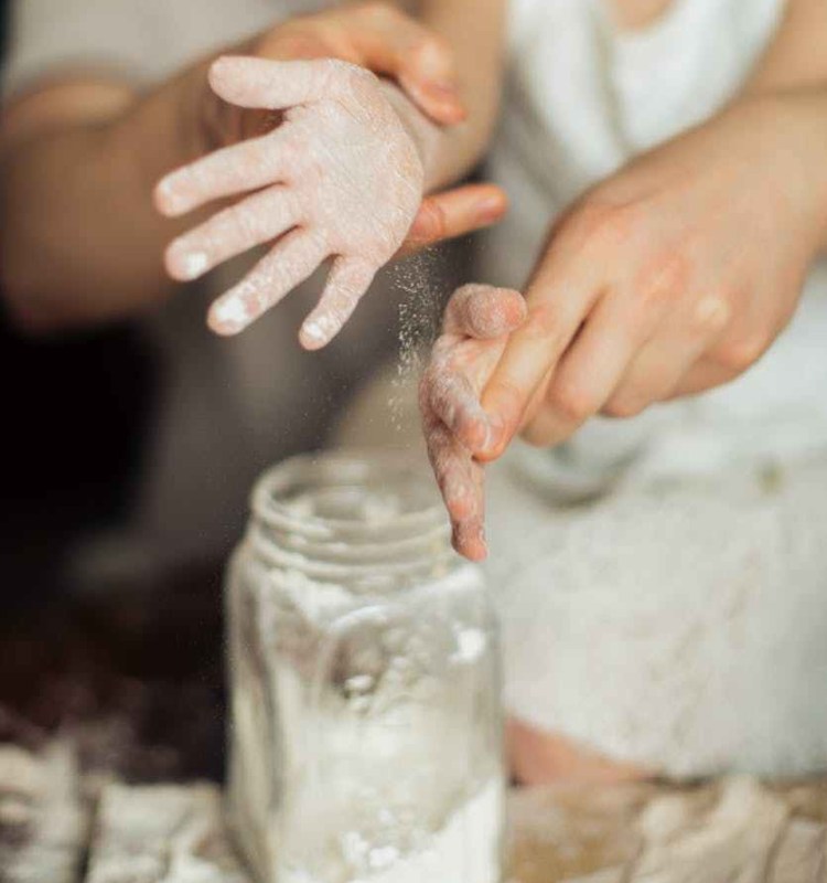 dusting flour from a child's hands