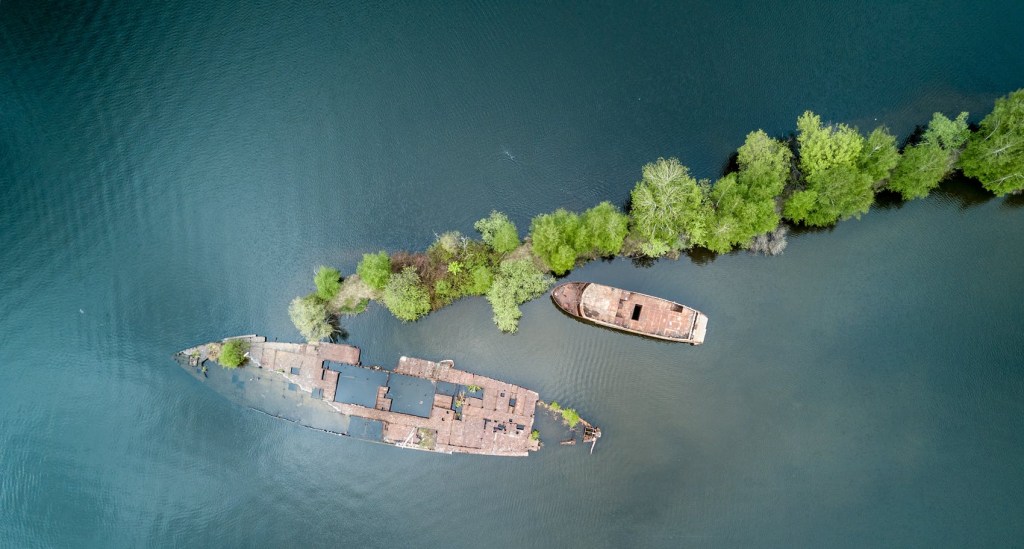 shipwrecked boats on a tiny island