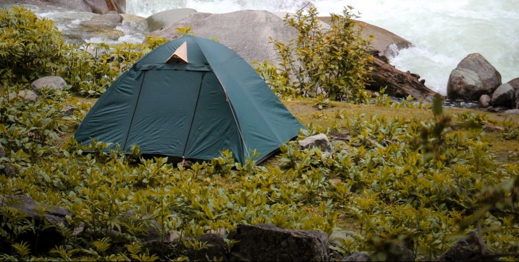 tent pitched near rocks.