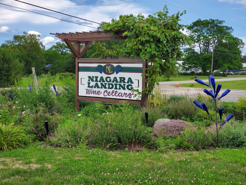 Winery sign decorated with blue bottles
