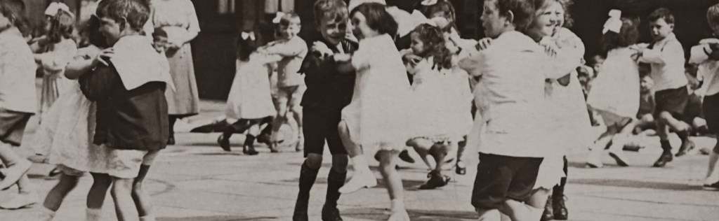 old photo of kids dancing on the playground