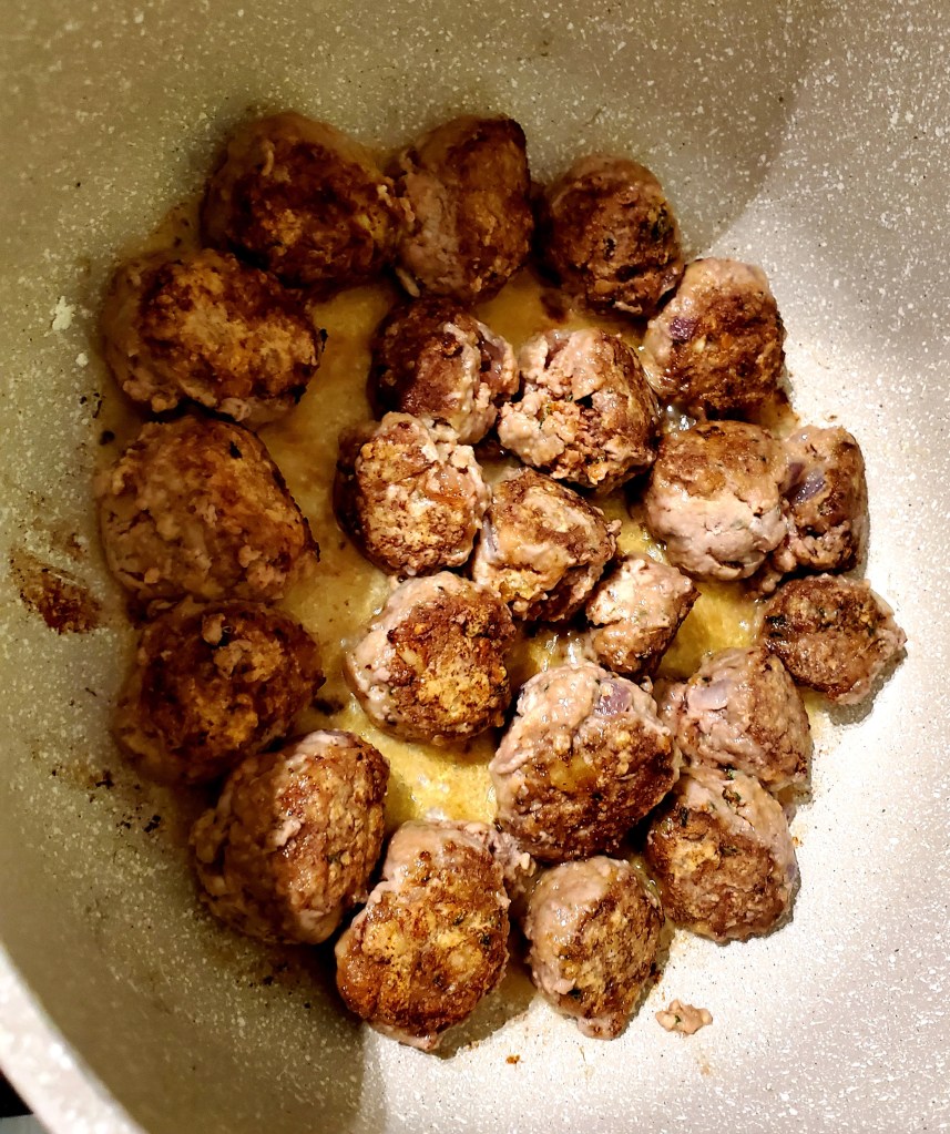 Browned meatballs in the pan
