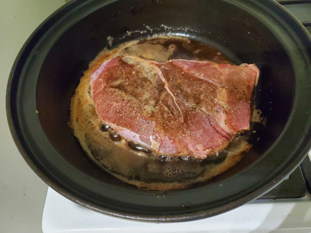 London Broil in the cast iron pan with brown butter surrounding