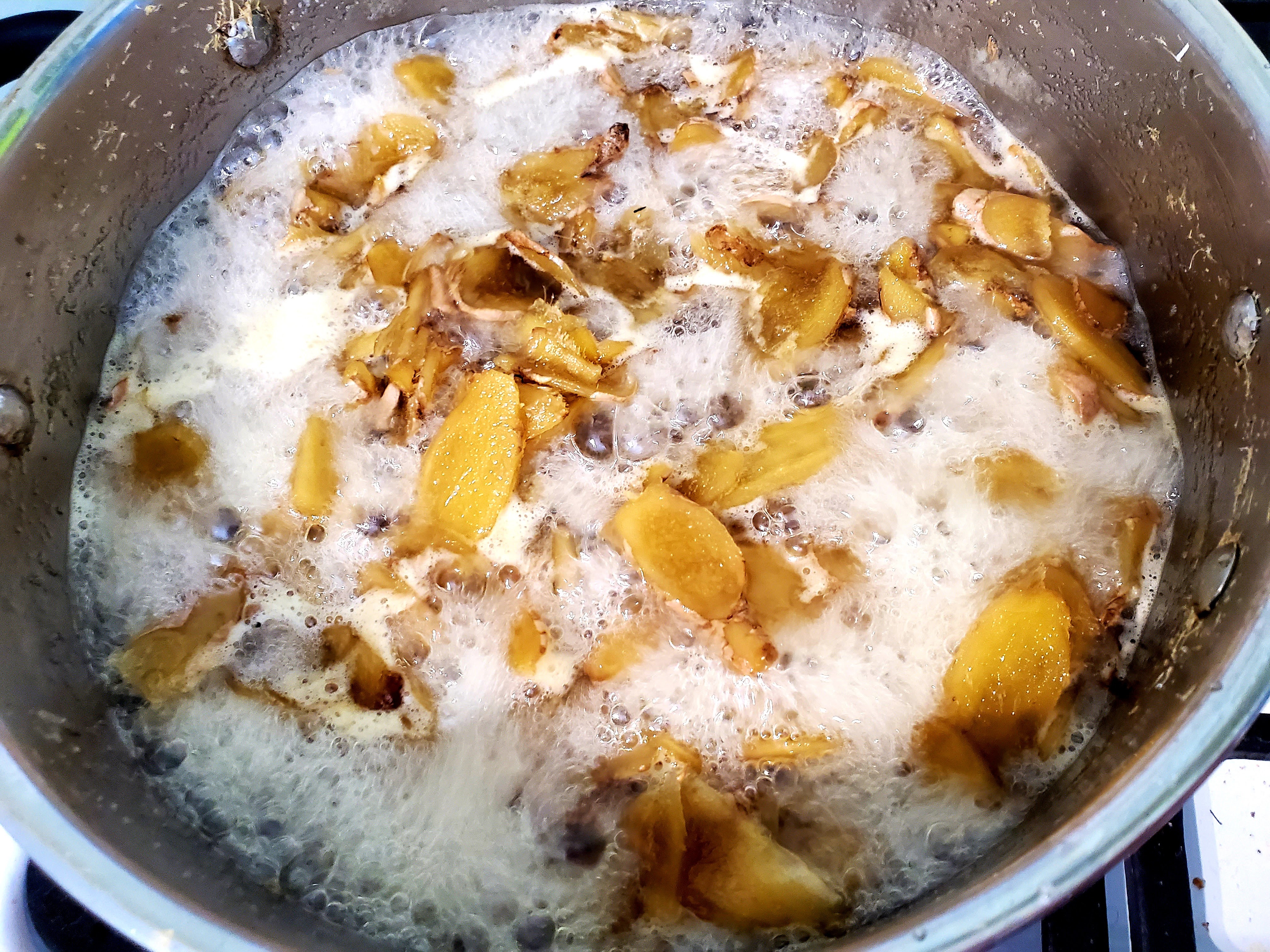 Ginger and lemon zest boiling in sugar